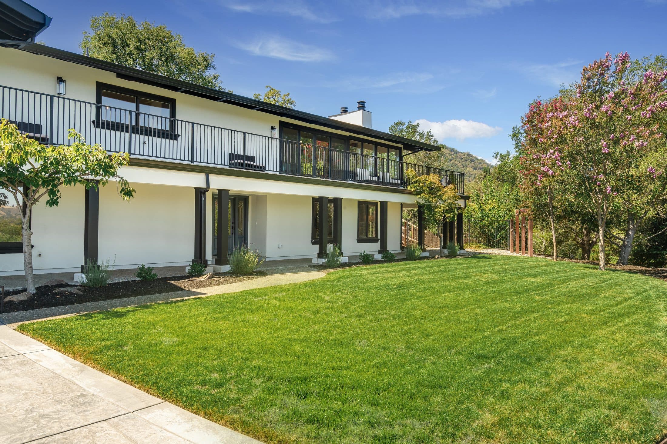 481 Montcrest Place. The long elevation seen across the front lawn.