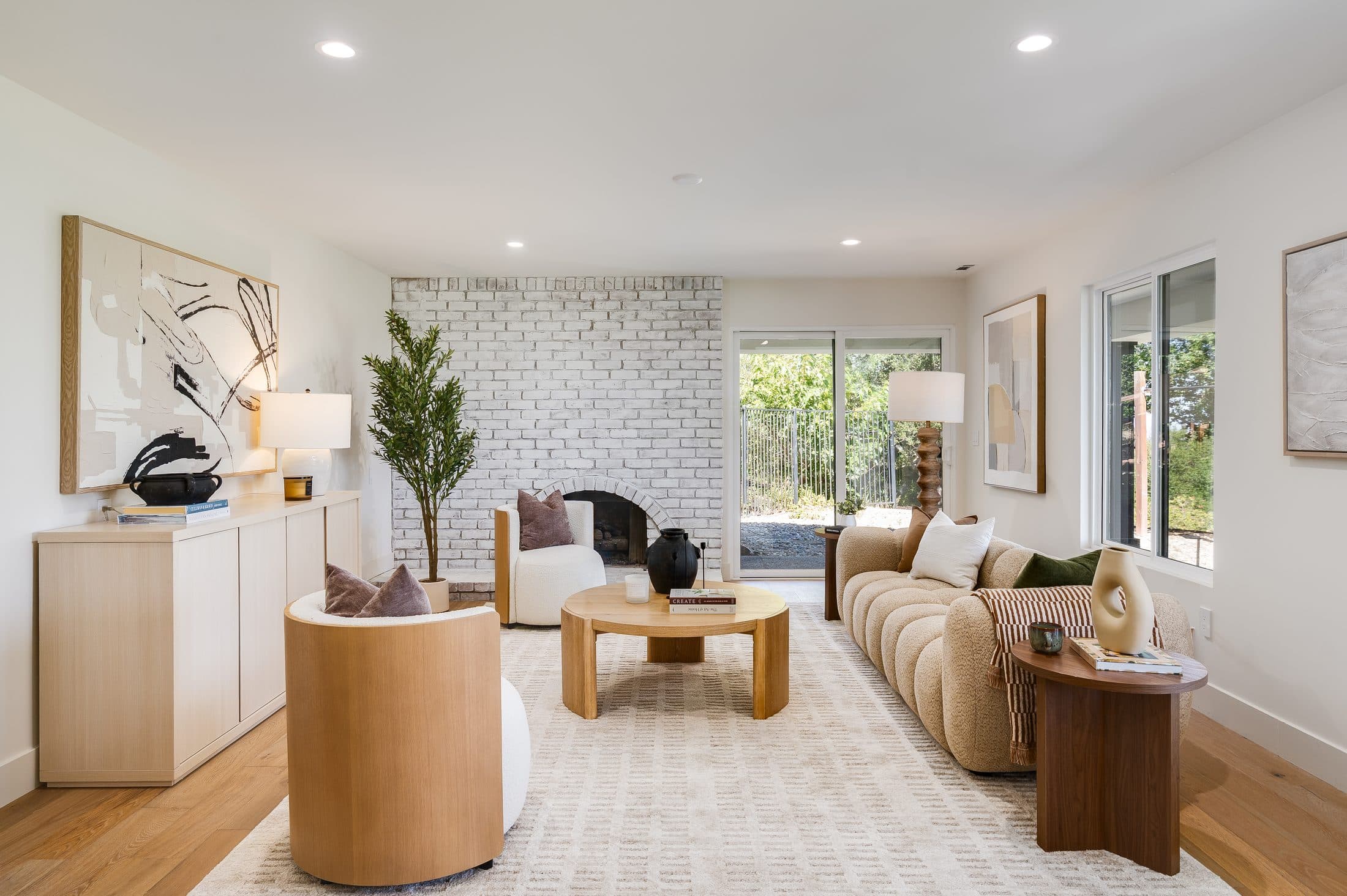 481 Montcrest Place. The lower living room's whitewashed brick fireplace and tiled hearth wall.