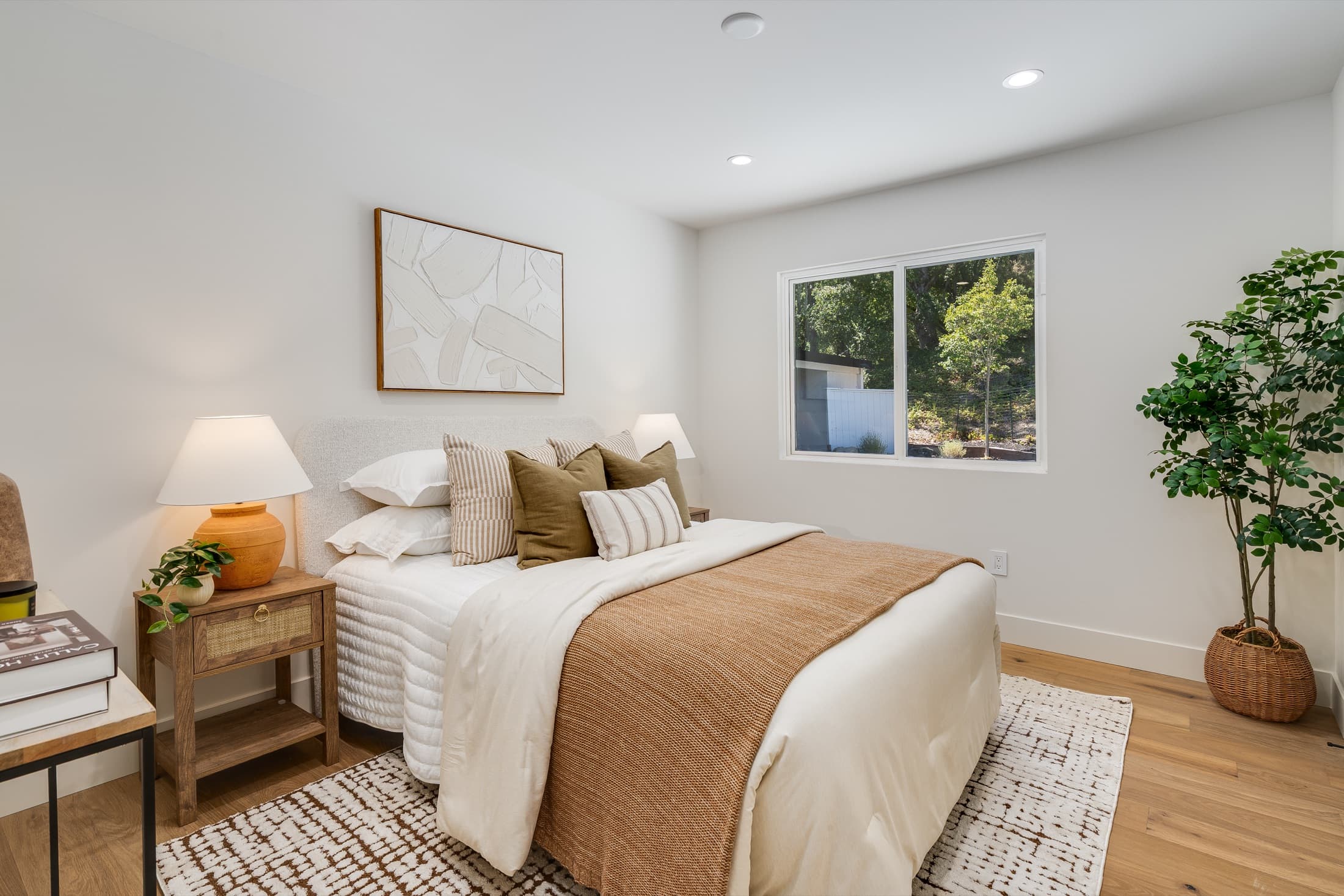481 Montcrest Place. A secondary bedroom in white oak, with a window onto the oaks.