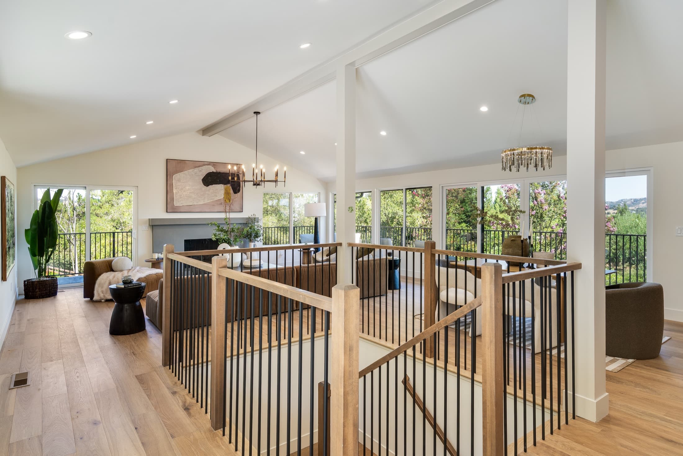 481 Montcrest Place. The upper level seen from the stair, under a vaulted ceiling with an exposed beam.