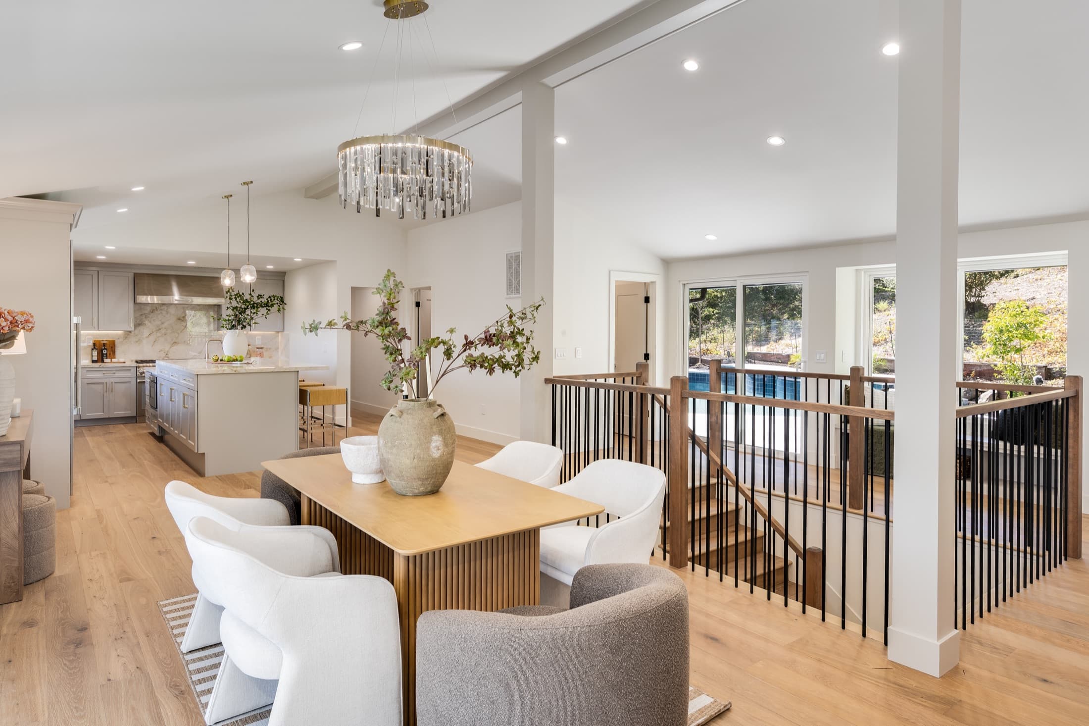 481 Montcrest Place. Dining looking through to the kitchen, with the pool visible below.