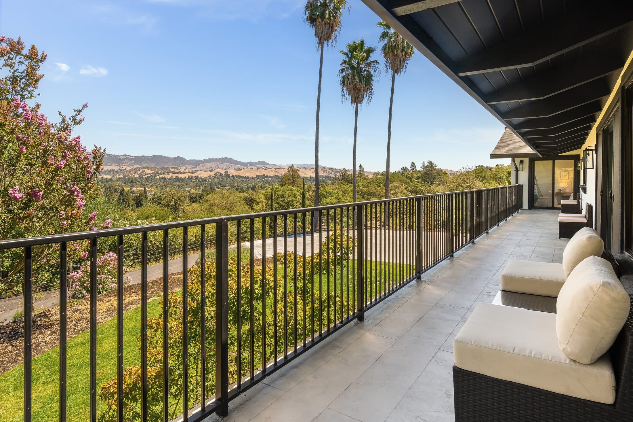 481 Montcrest Place. The deck looking out past the palms to the valley.
