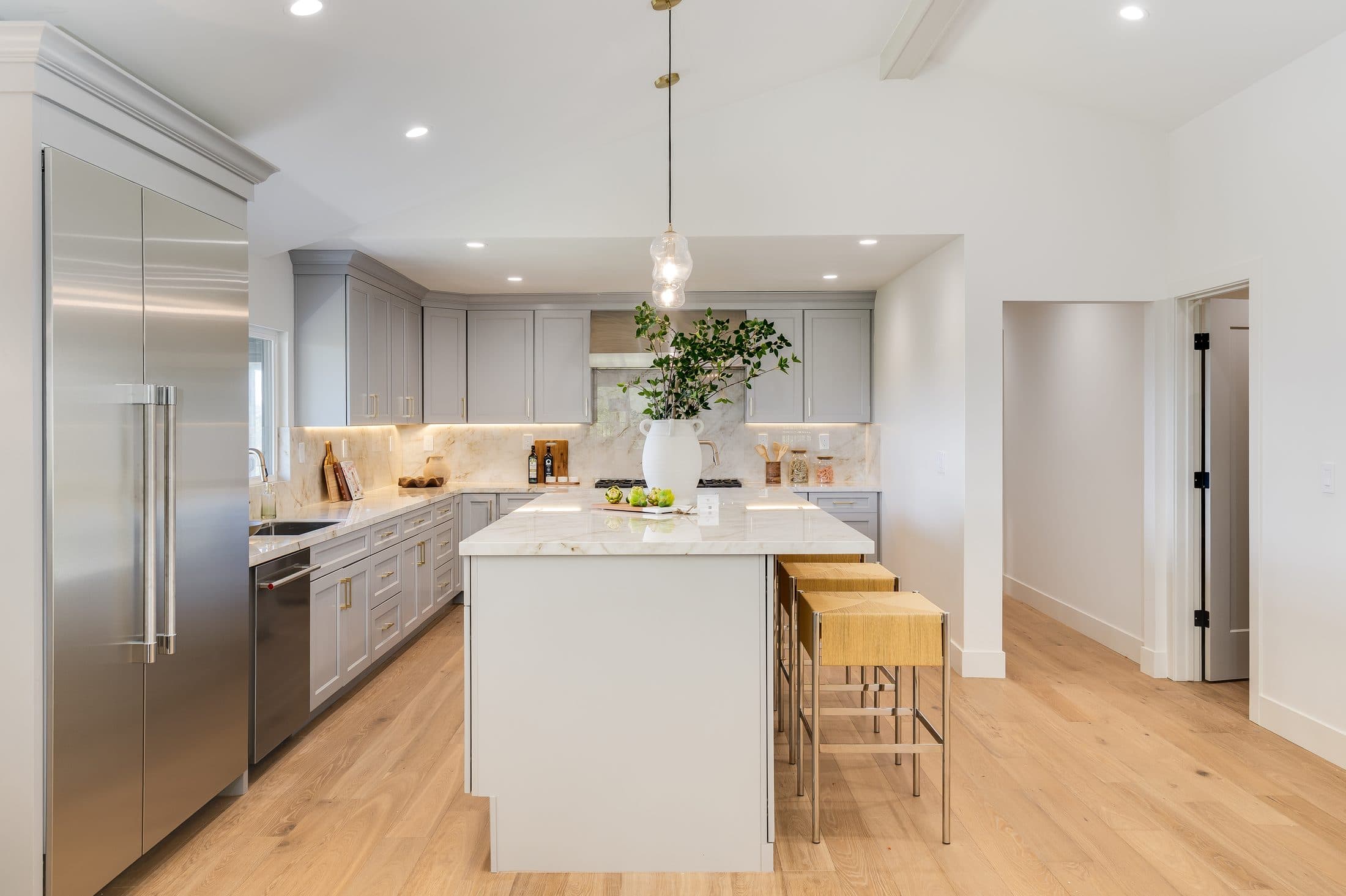 481 Montcrest Place. The kitchen in full, island and range under the vaulted ceiling.