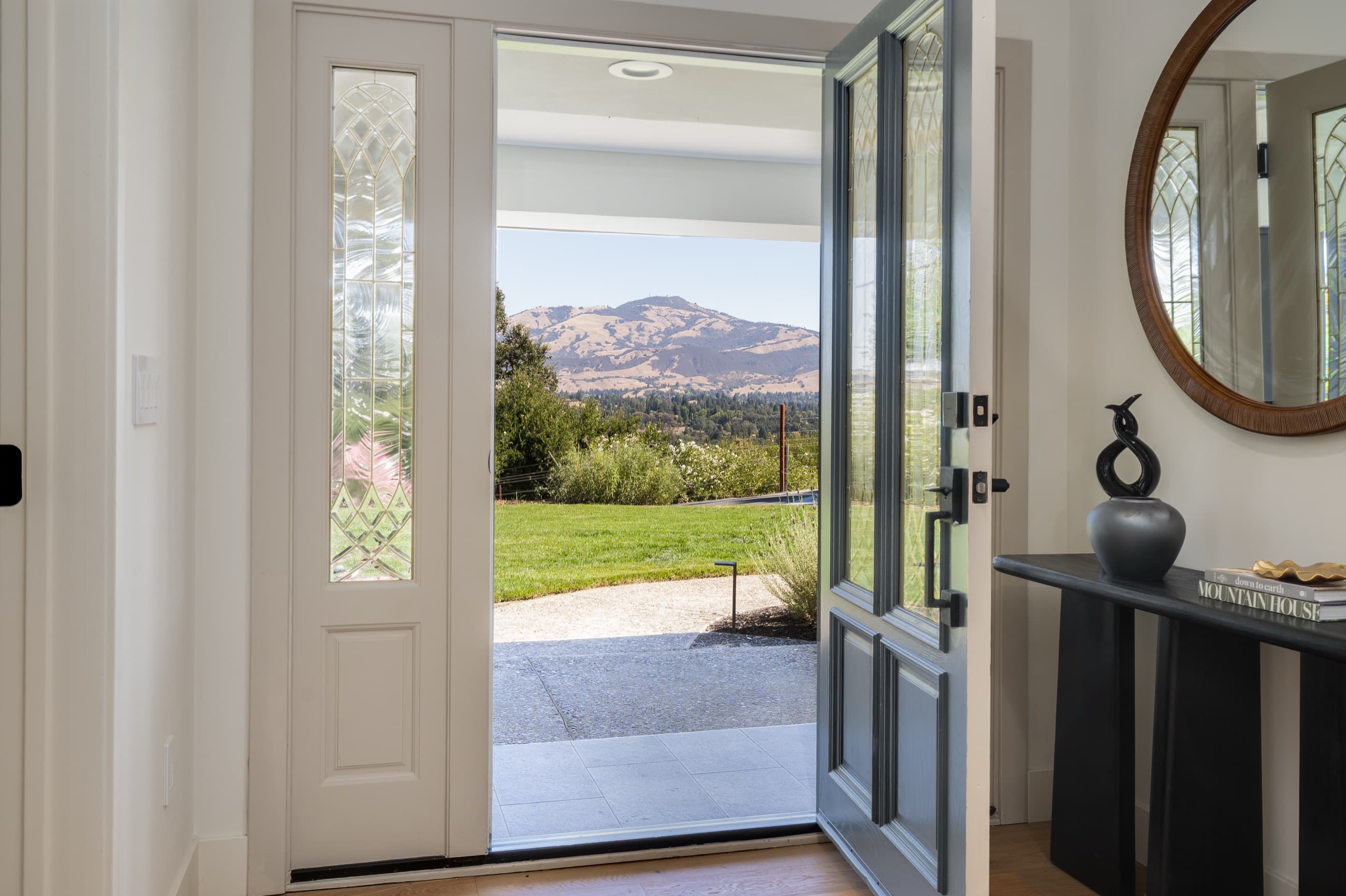 The front door of 481 Montcrest Place open onto the lawn, with Mount Diablo beyond.